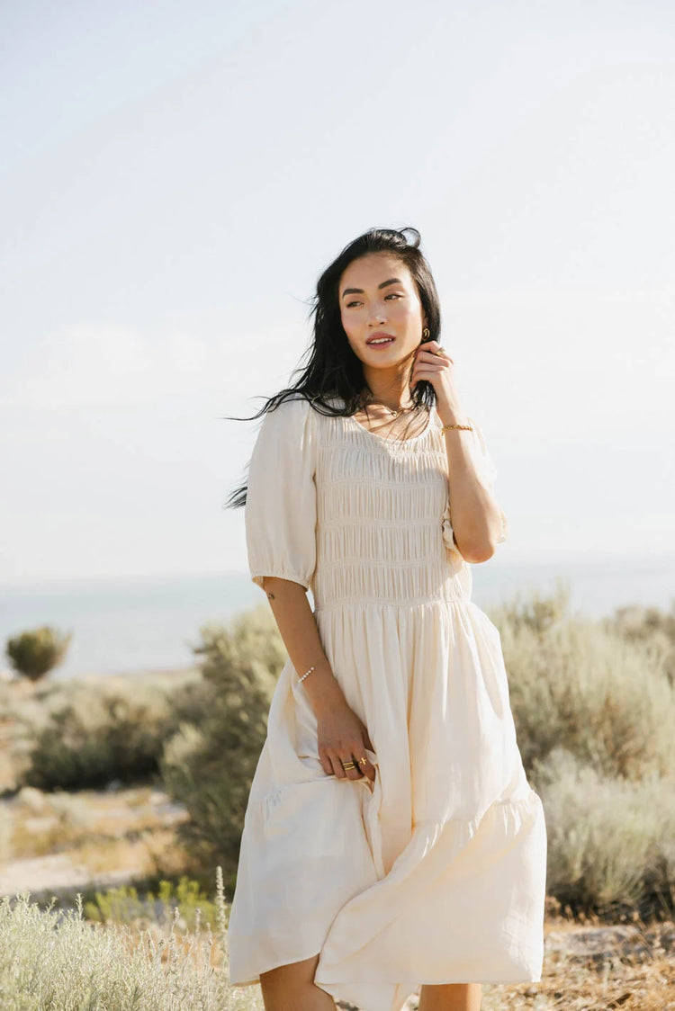 Round neck dress in cream 