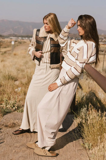 Sweater in cream paired with corduroy pants 