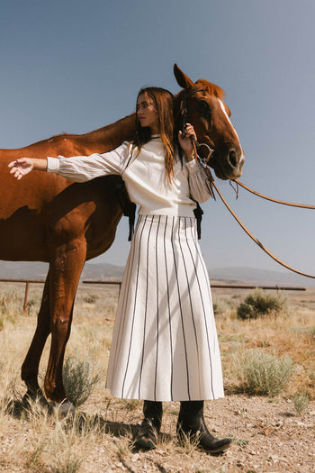 striped blouse with sweater vest