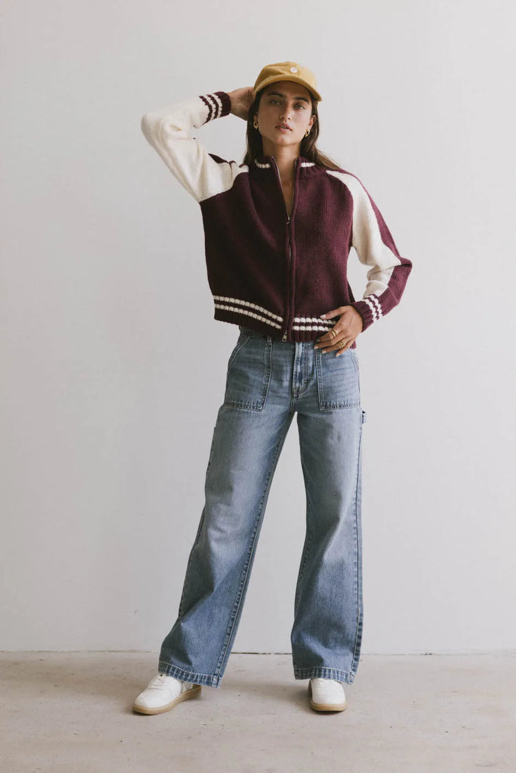 Sweater in white paired with a denim 