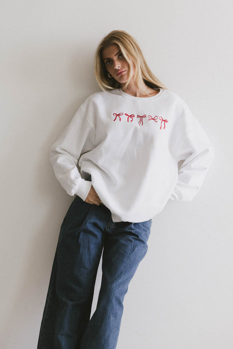 red bow sweater in white