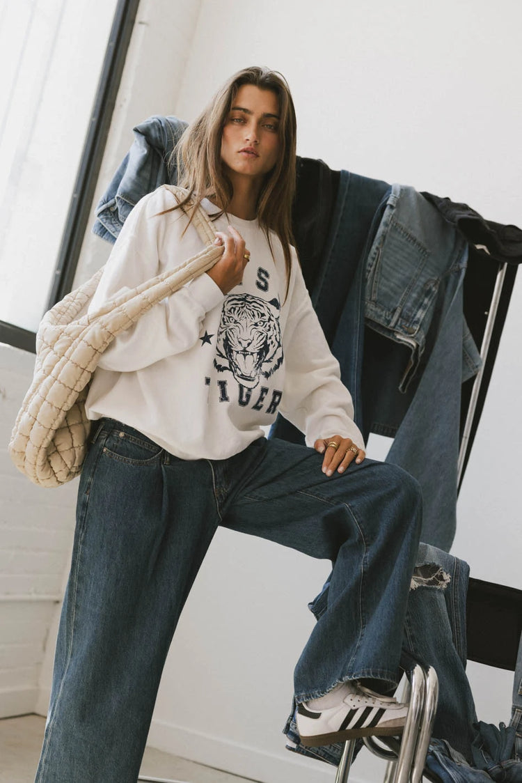 Sweatshirt paired with a dark wash denim 