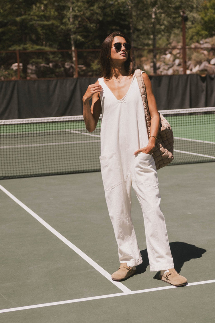 cream jumpsuit with front pocket