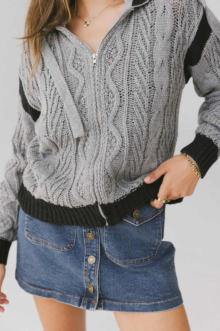 grey and black knit zip up