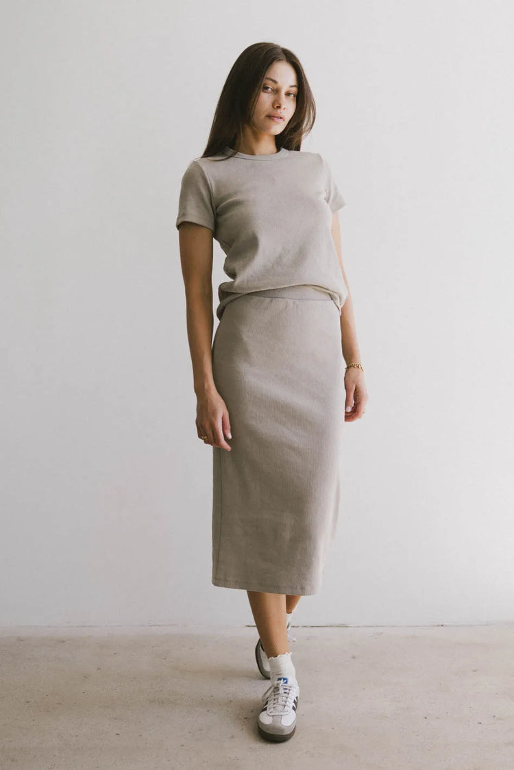 Top in taupe paired with a taupe skirt 