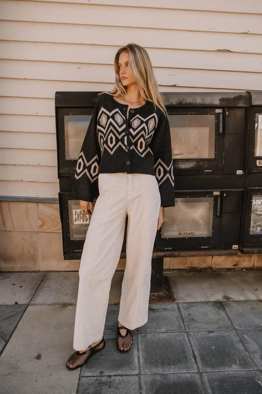 Corduroy pants in cream paired with a sweater 