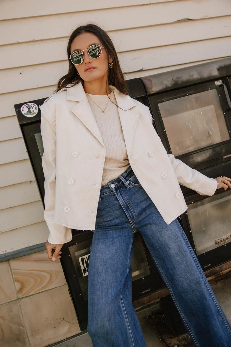 Round neck ribbed tp in cream paired with a cream jacket 