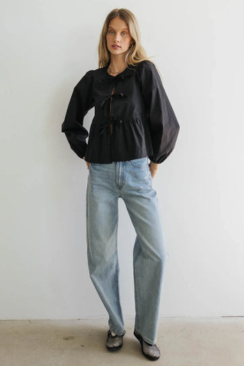 Blouse paired with  light wash denim 