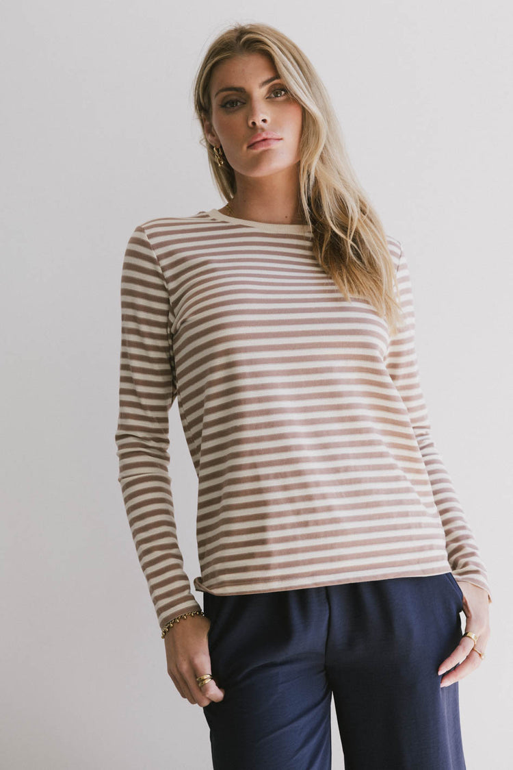 brown and white long sleeve top