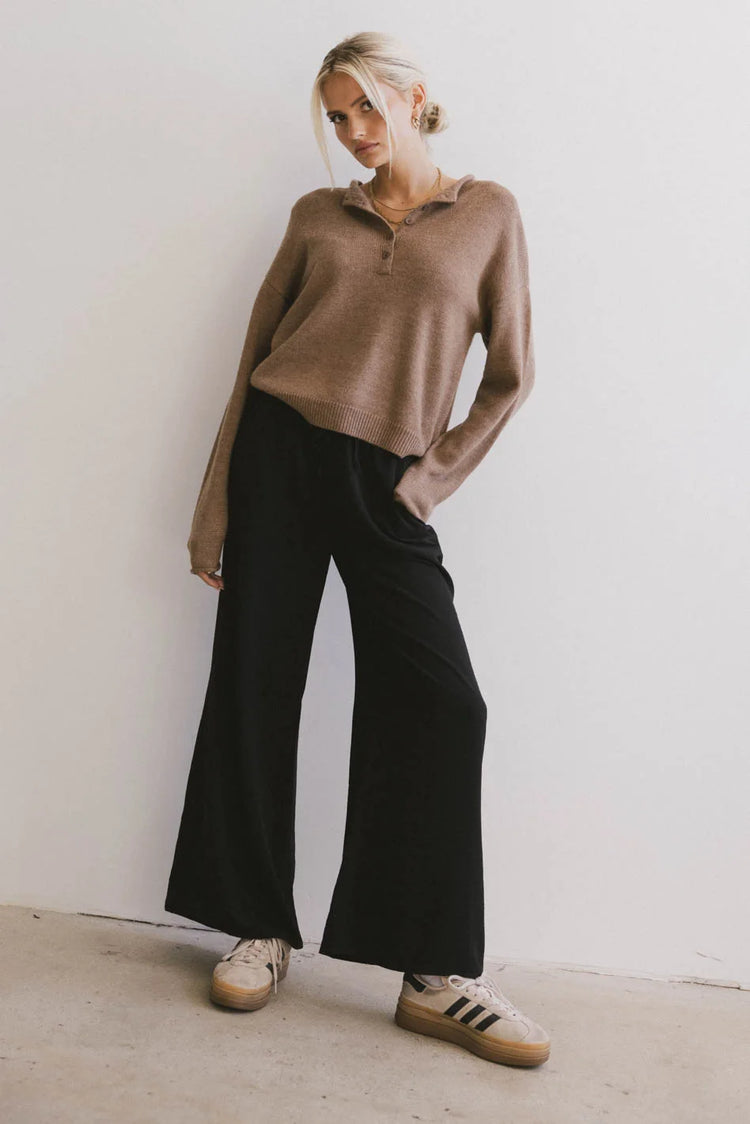 Knit top in brown paired with a wide leg pants in black 