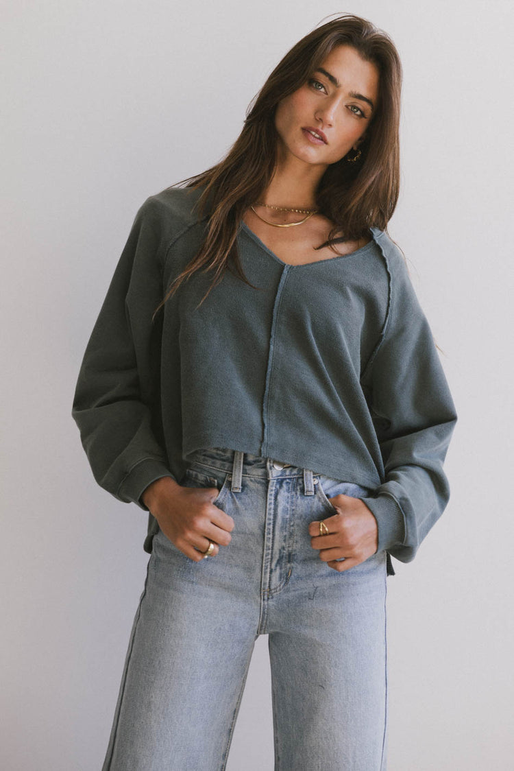 exposed seam sweater in teal