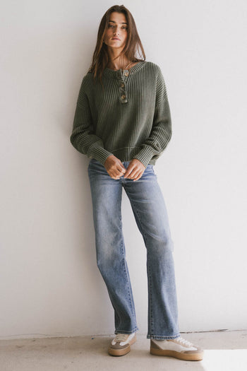 green ribbed sweater