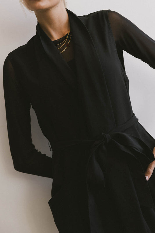 black sleeveless wrap dress