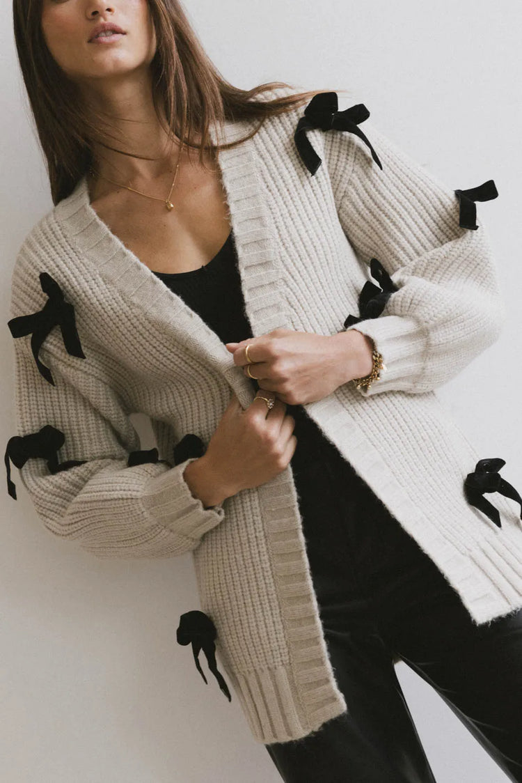 Cardigan with black bows 