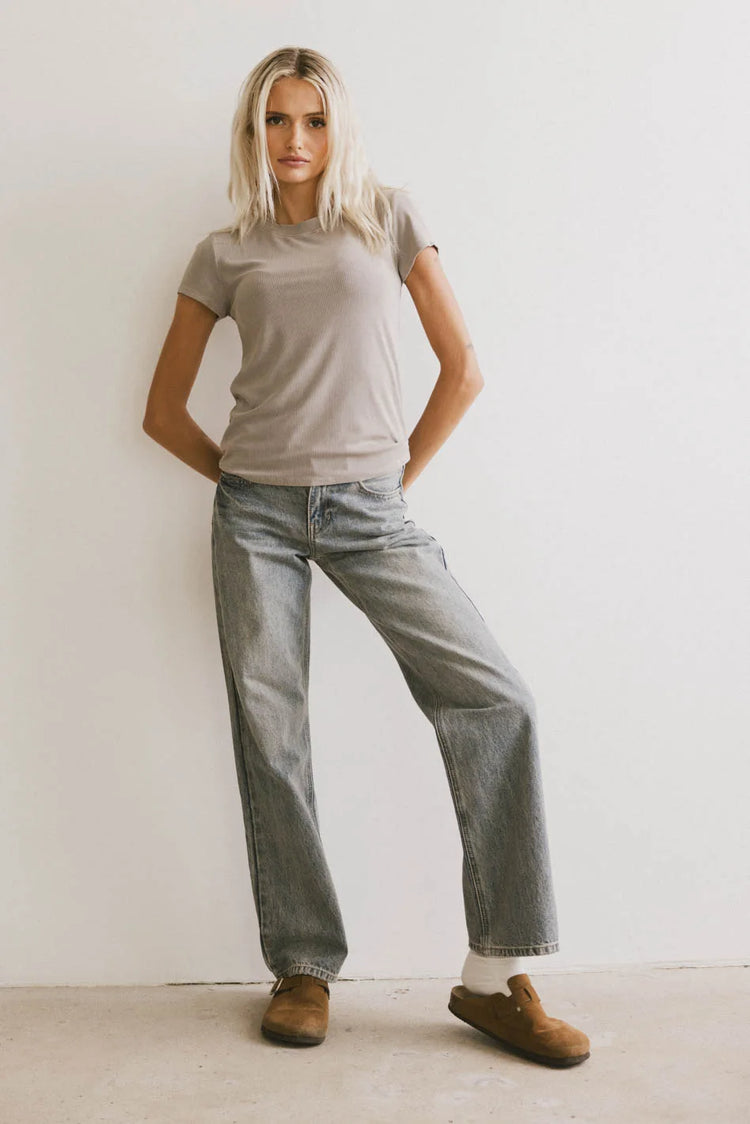 Basic top in taupe paired with denim jeans 