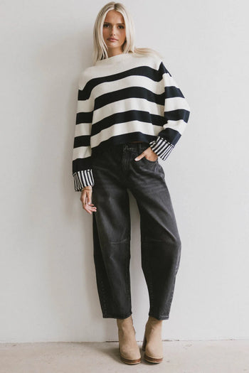 Knit sweater in black paired with black denim 