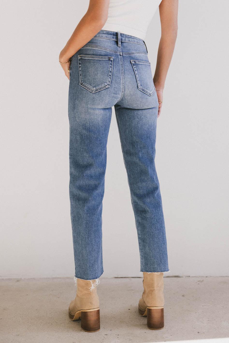 medium wash denim with raw ham 