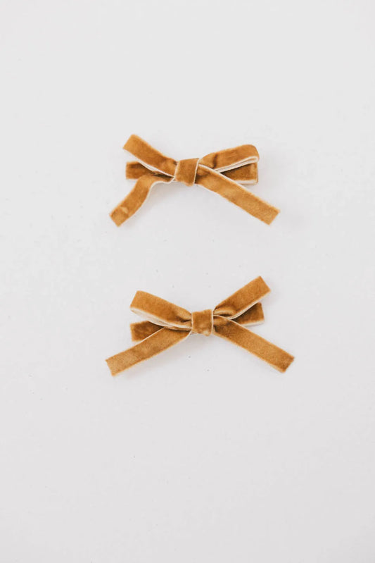 Small velvet bows in yellow 