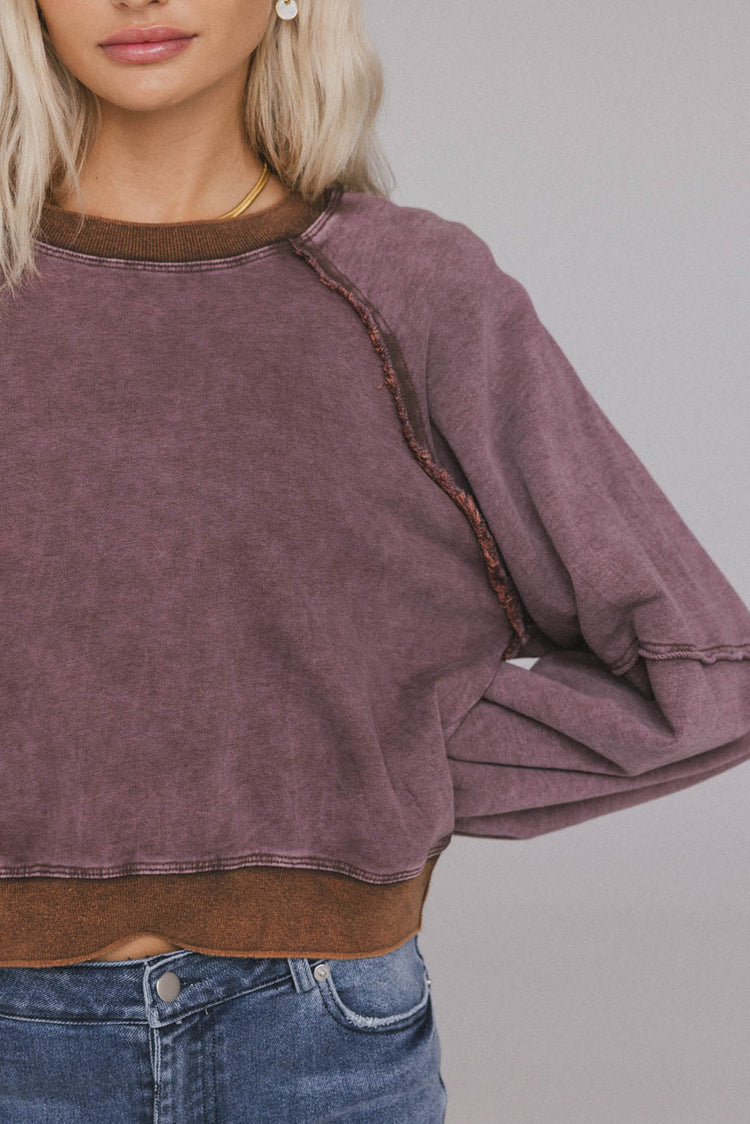 raw hem sweater in berry