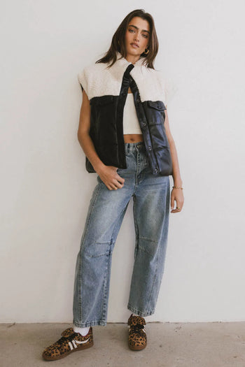 Vest in block color paired with denim 