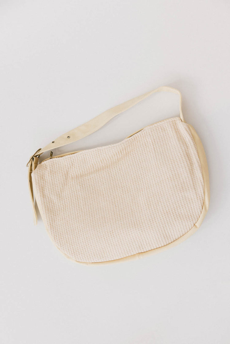 ivory woven bag with buckle strap