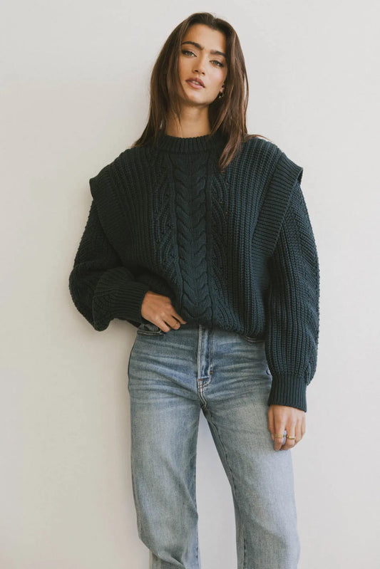 Round neck cable knit sweater in hunter green 