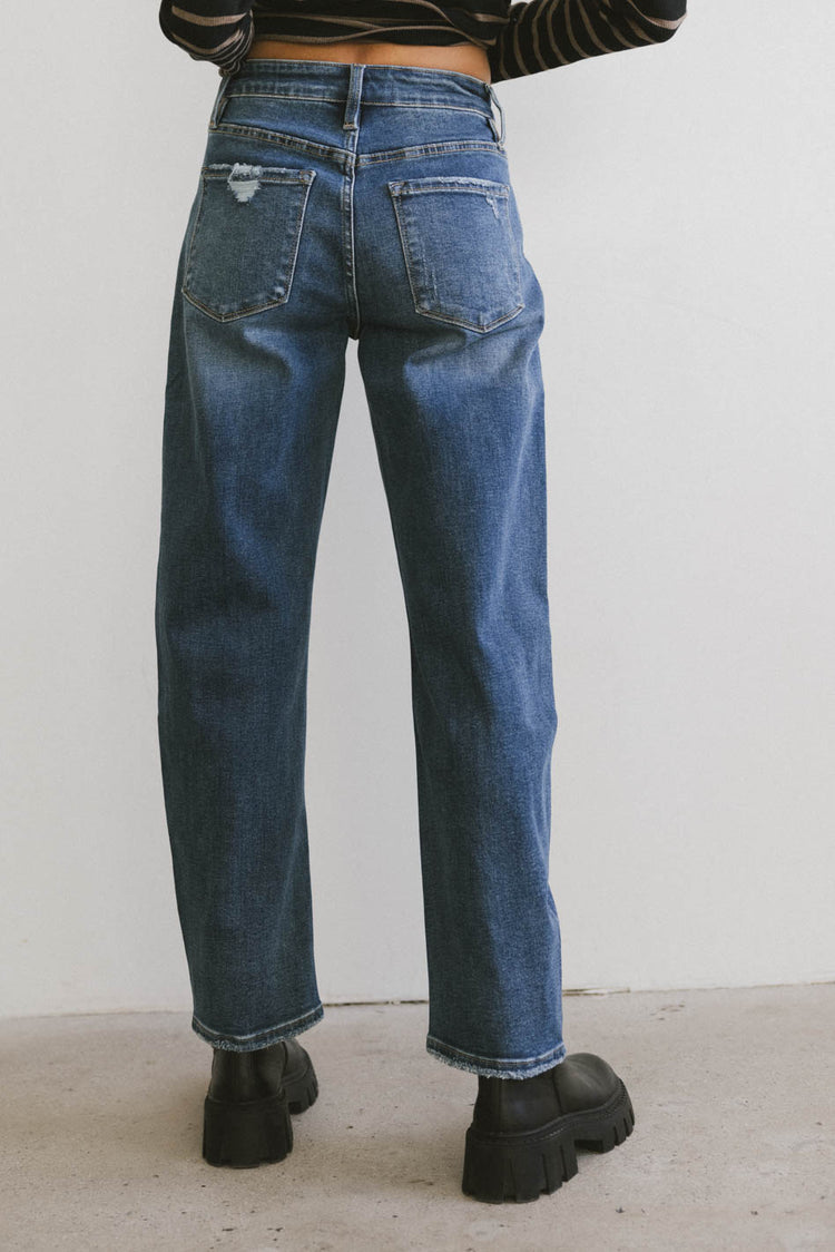 medium wash denim jeans in barrel style