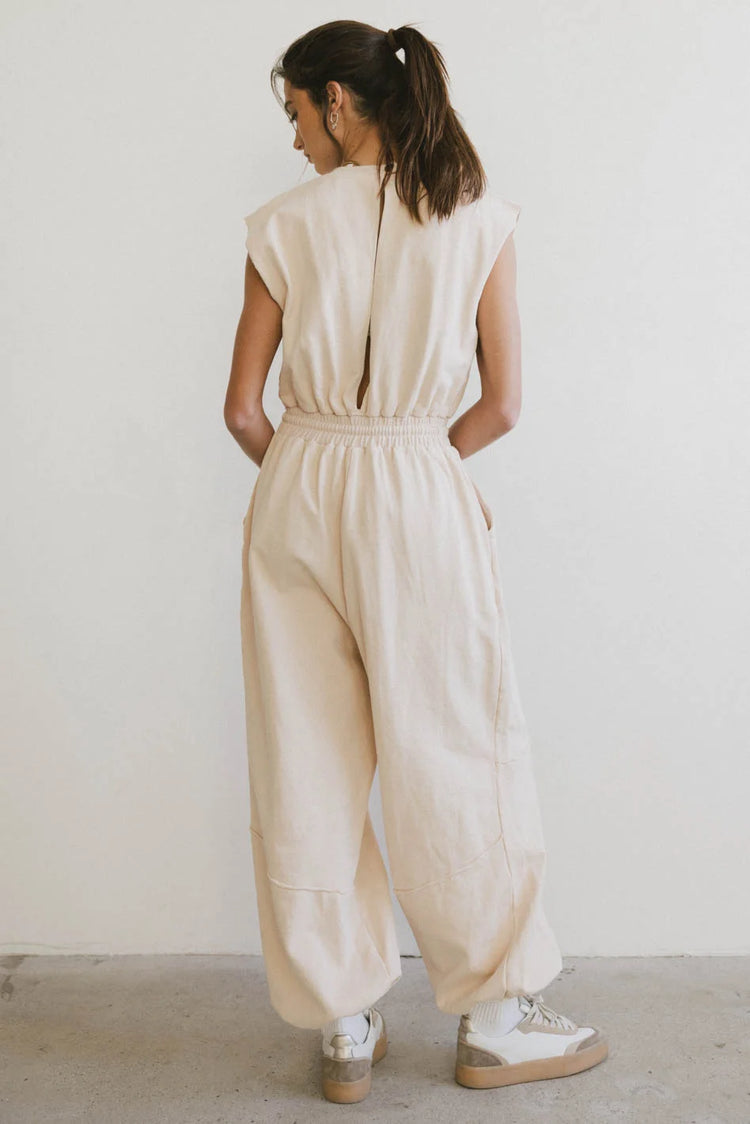 Opened back jumpsuit in cream 