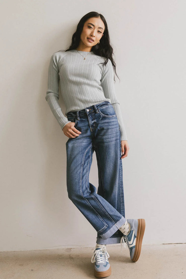 Mock neck sweater paired with a denim 