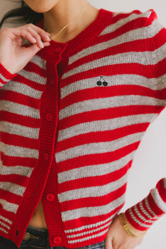 red knit sweater with cherry