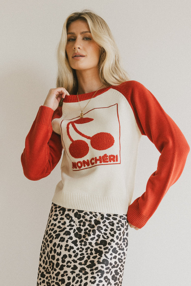 red and ivory cherry graphic sweater