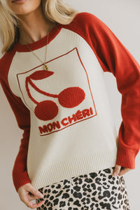 red and white cherry sweater