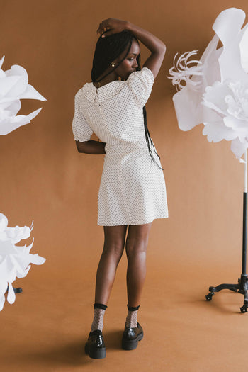 white and black polka dot dress