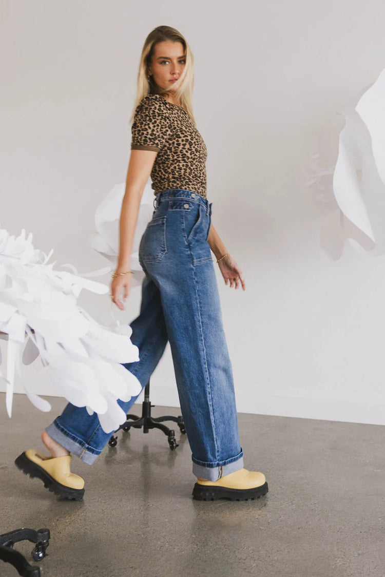 Denim paired with a leopard print top 