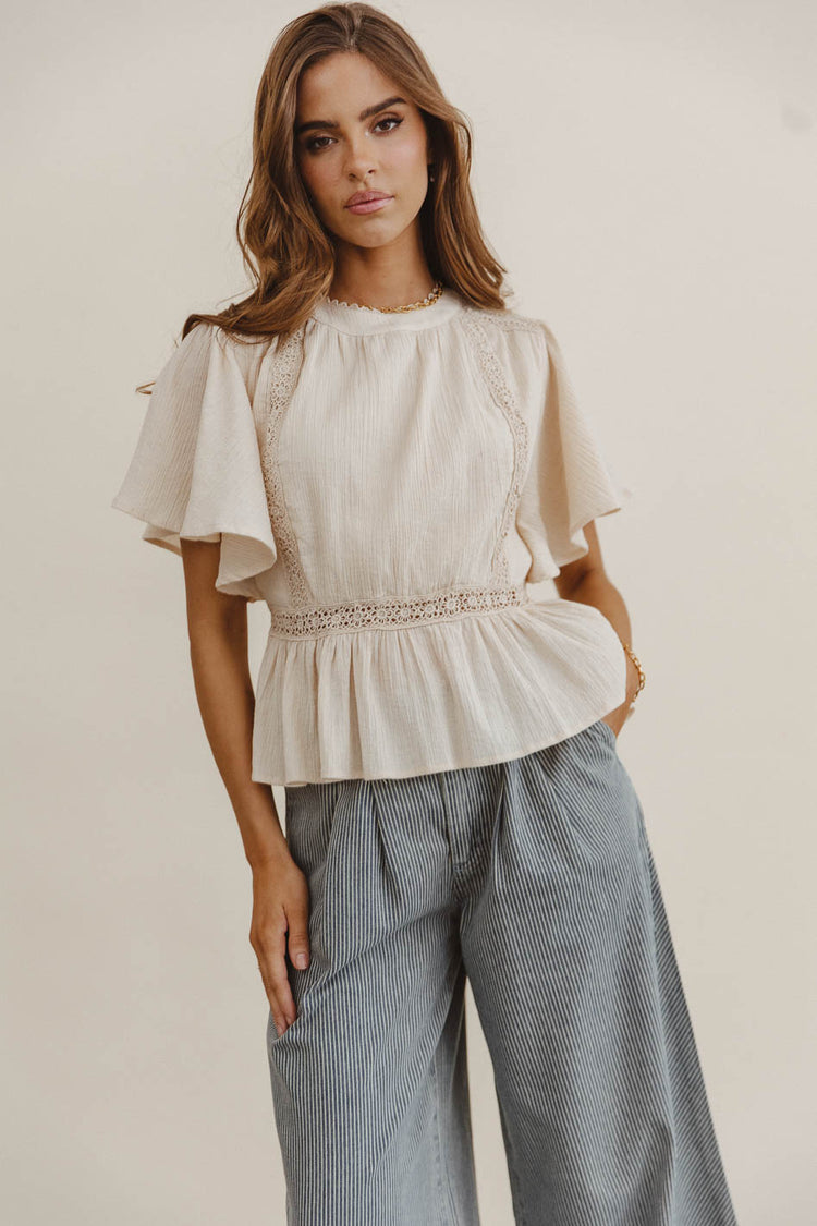 Ruffled hem top in oatmeal 