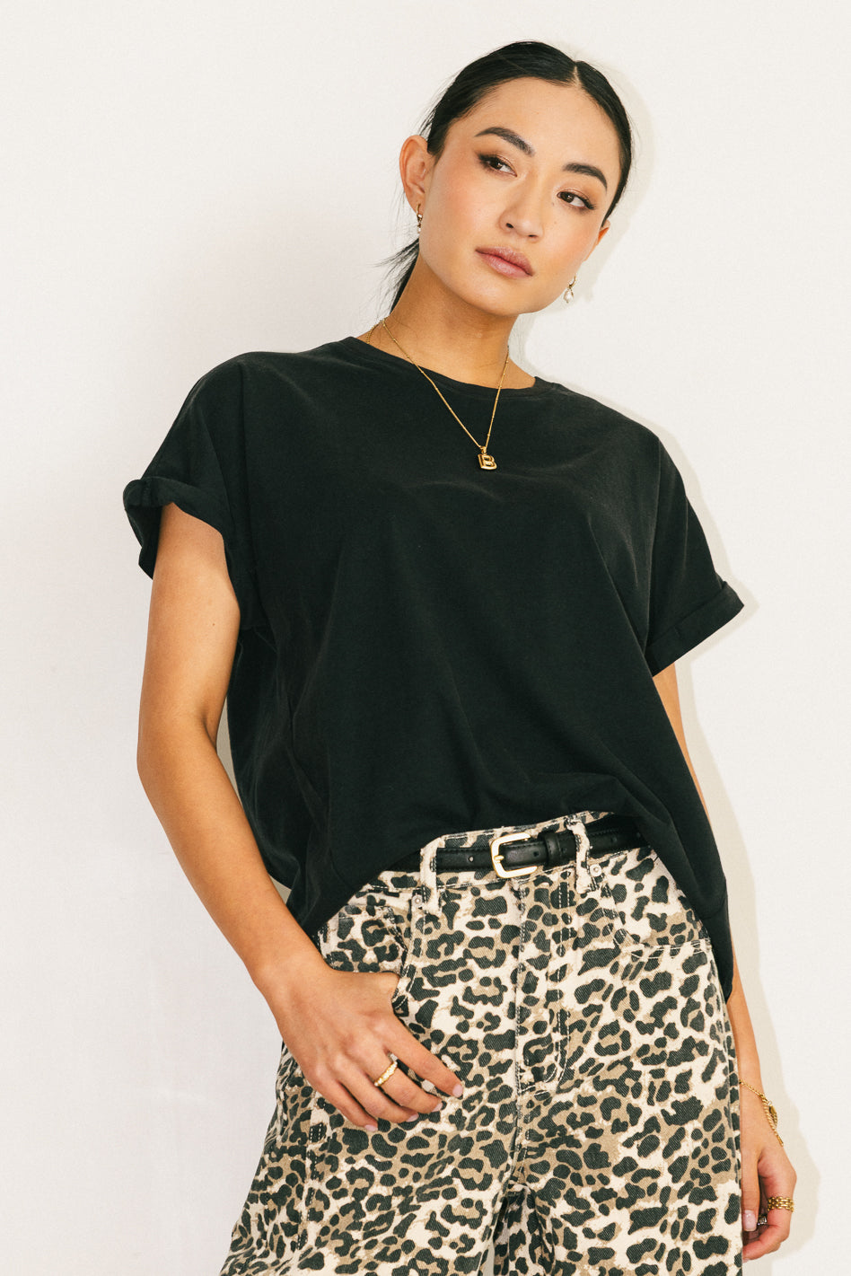 ROLLED SLEEVES ON BLACK TEE SHIRT