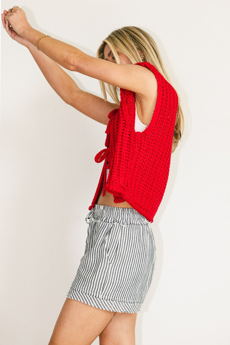 red sleeveless vest