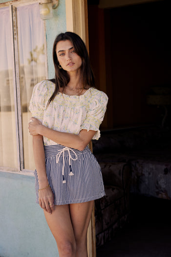 navy striped drawstring skort and yellow short sleeve blouse