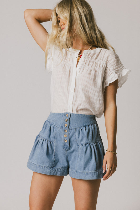 white ruffle blouse