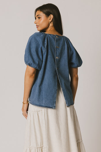 THREE BUTTON DETAIL ON BACK OF DENIM TOP 
