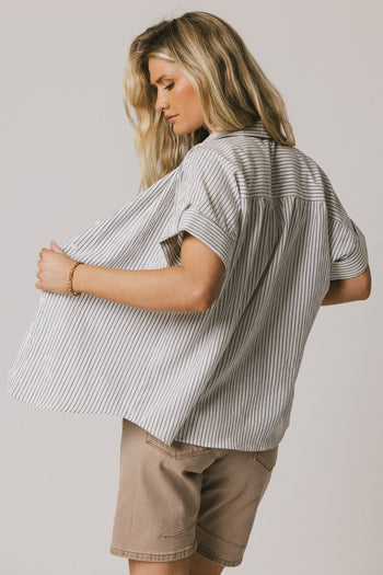 SHORT SLEEVE CUFFED SLEEVES ON NAVY BUTTON UP 