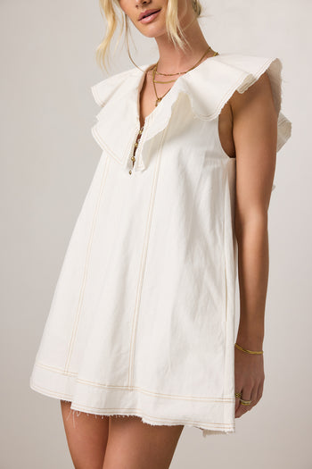 white dress with ruffle detail