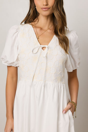 white dress with embroidered detail