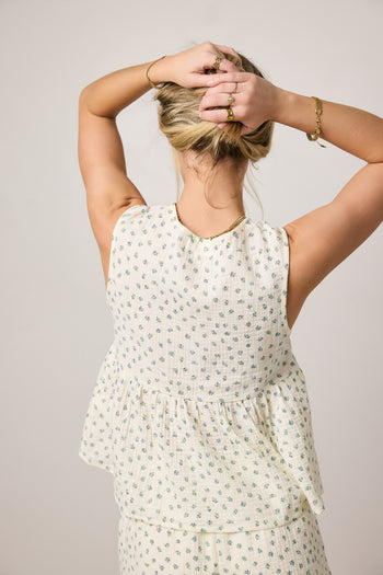 cream top with blue floral print