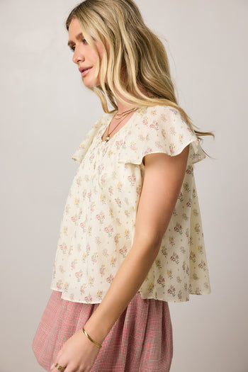 floral blouse with flutter sleeves