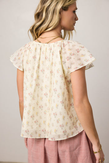 cream blouse with floral print