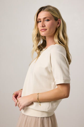 cream top with ribbed hem