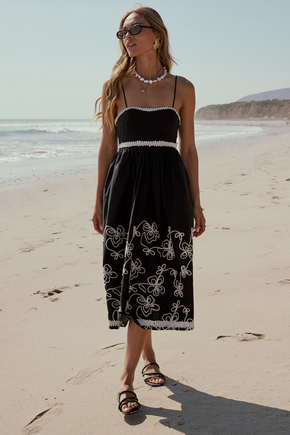 sleeveless black midi dress