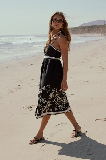 black dress with white embroidery