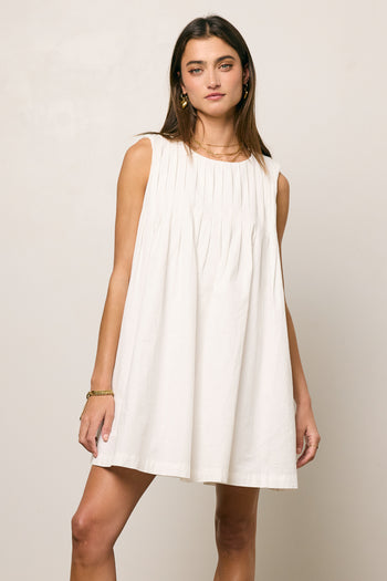 pleated white dress